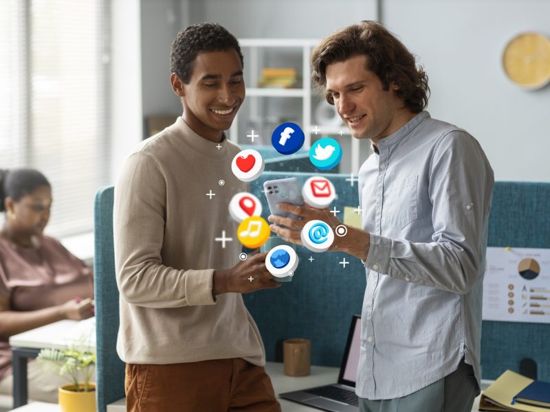 medium-shot-men-holding-smartphone